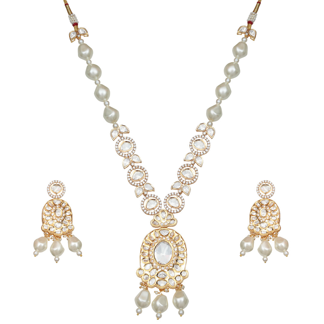 Gold finished Polki Necklace Set Adorned With White Pearls, Accompanied By Matching Danglers.