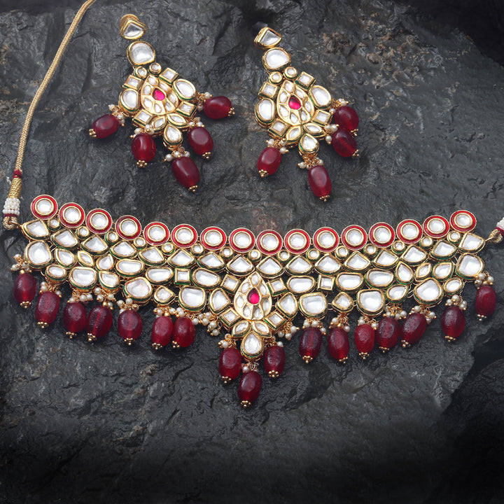 Gold finished Kundan and Polki Choker set with matching Danglers.