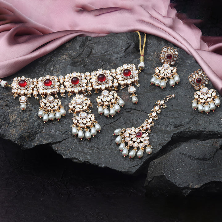 Gold finished Kundan Polki Choker set with matching Danglers and Mang Tikka