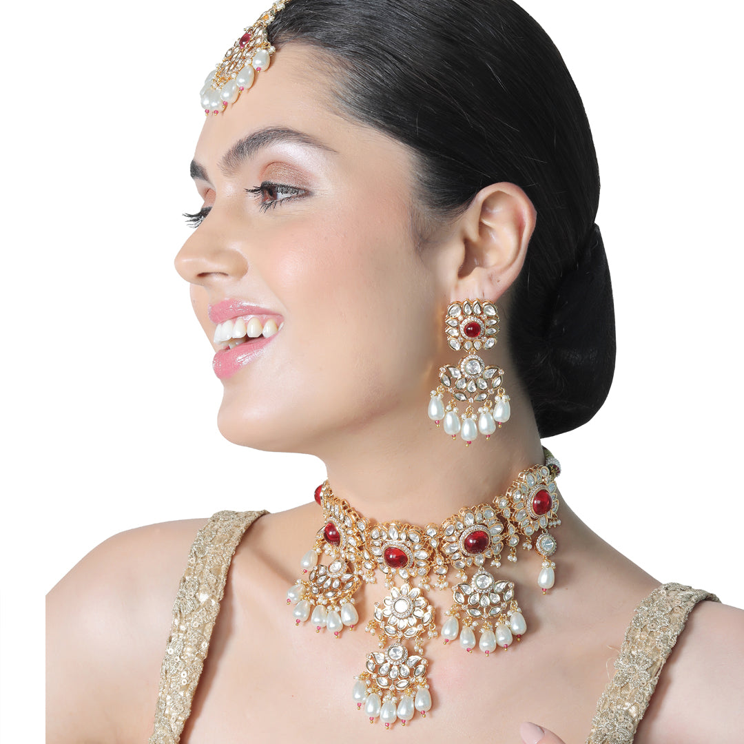 Gold finished Kundan Polki Choker set with matching Danglers and Mang Tikka