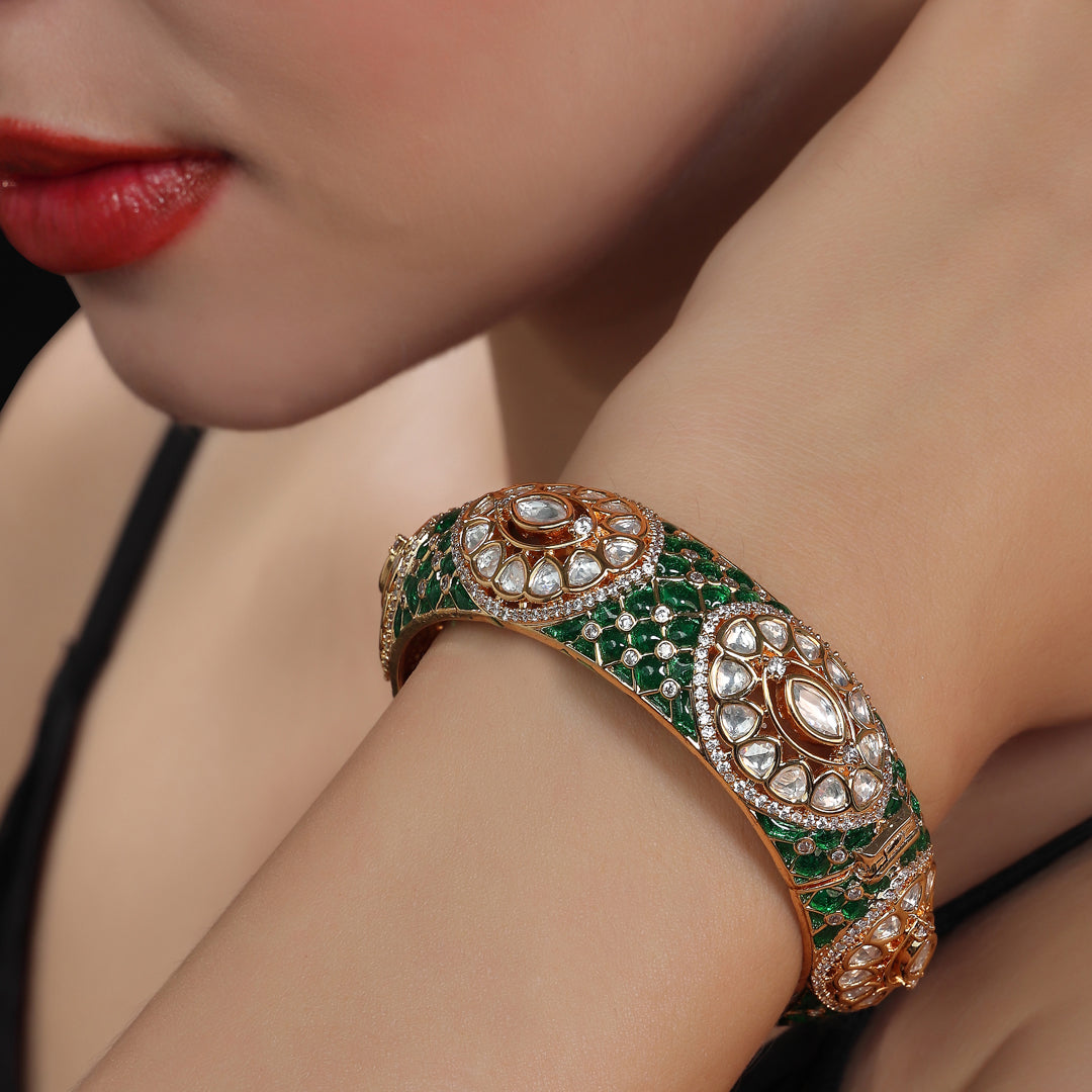 Gold finished Kundan Polki Kada with intricate green Meenakari work.