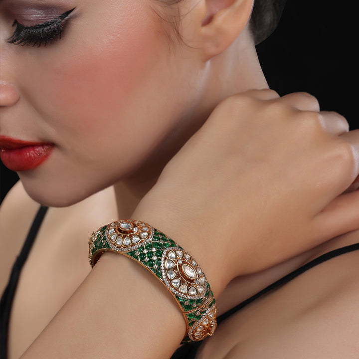 Gold finished Kundan Polki Kada with intricate green Meenakari work.